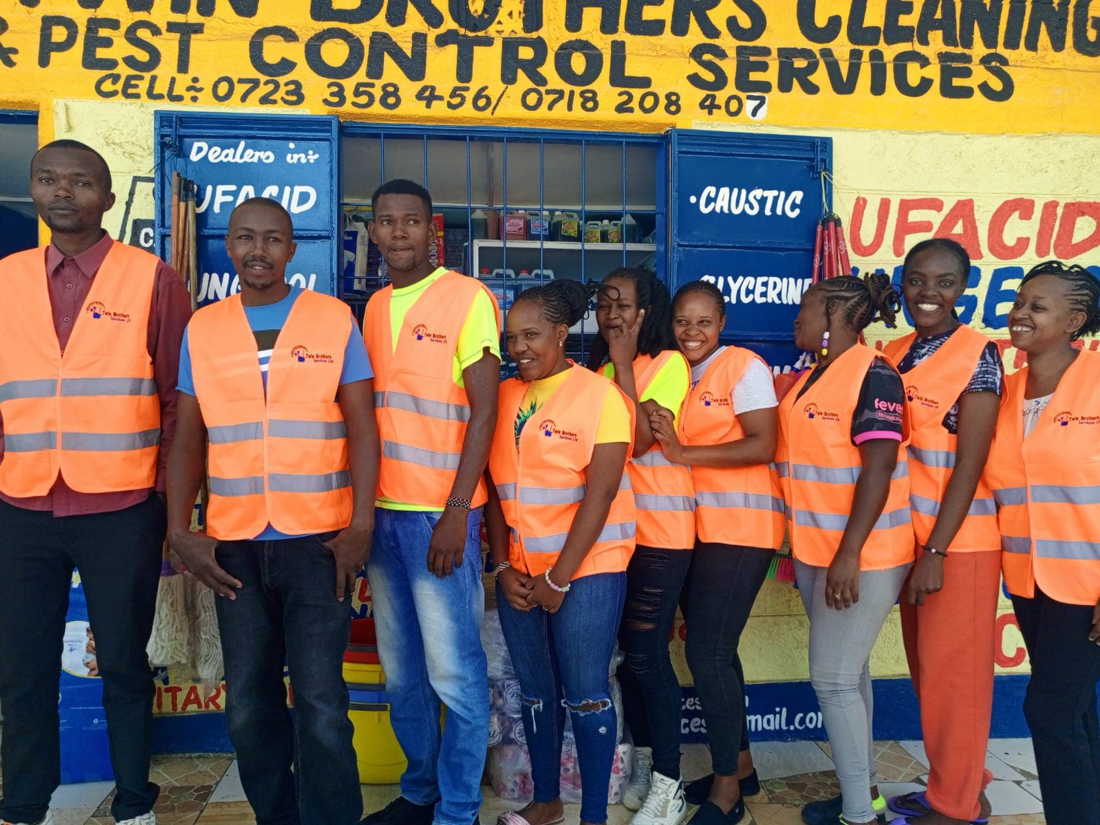 Twin Brothers field team in high-visibility vests outside the Nakuru office